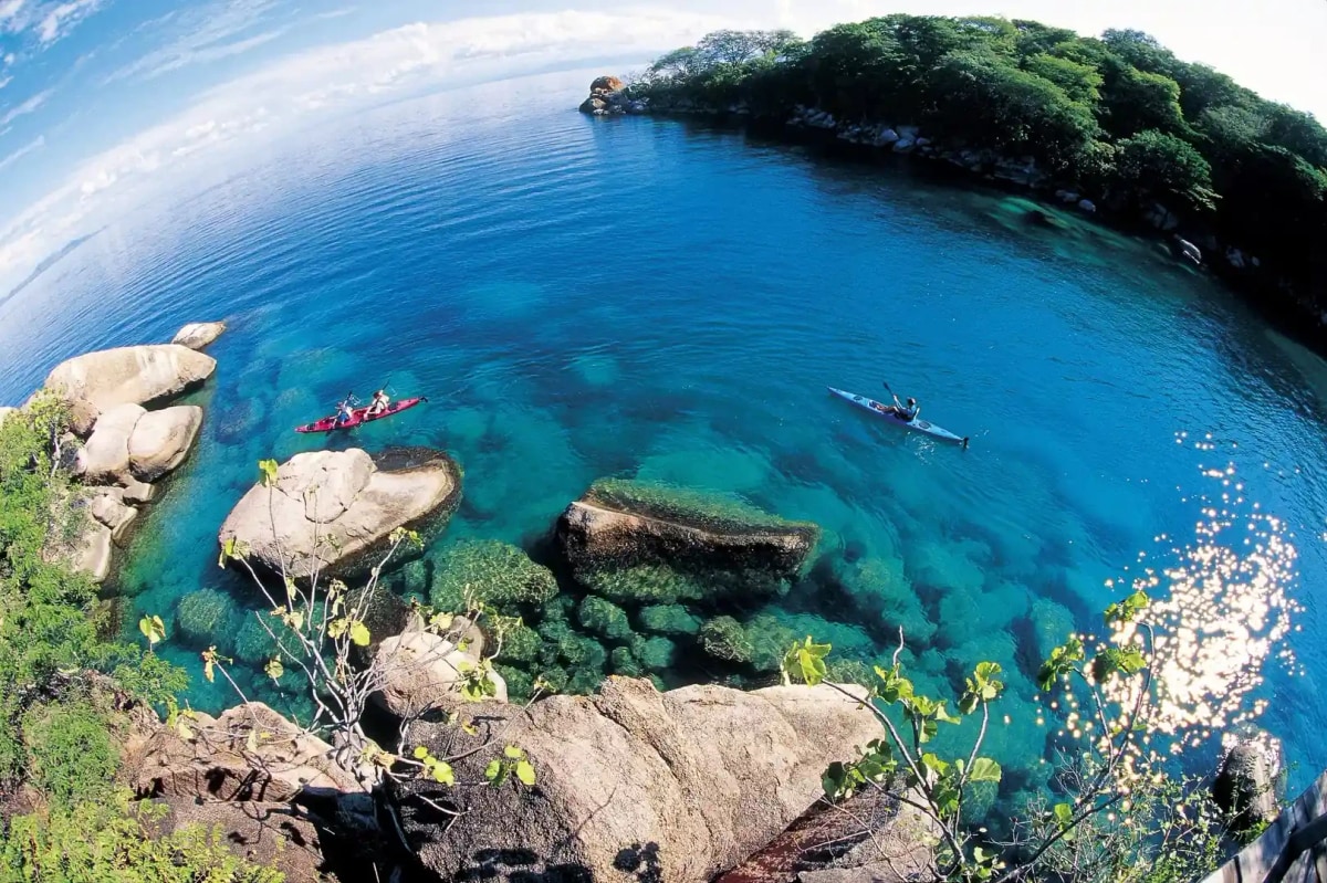 Aerial view of Cape Maclear bay with clear turquoise water and rocky formations